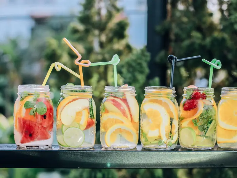 Jars of alcohol-free fruit drinks with colourful straws